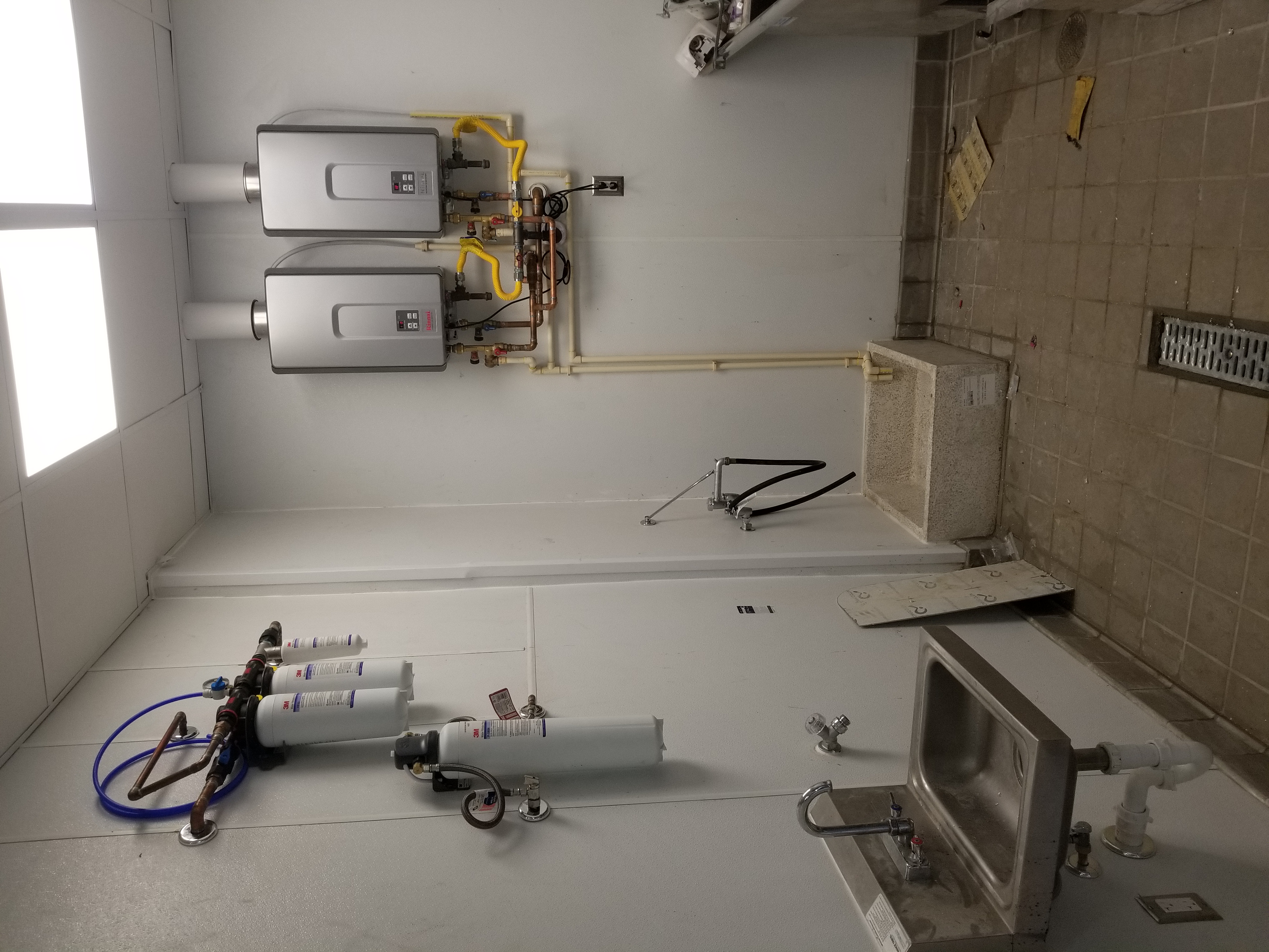 Our Plumber working in a house Our plumber repairing a wash basin